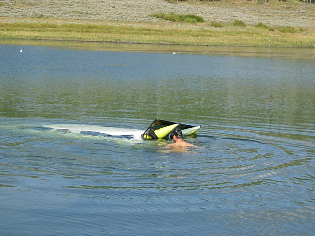 The truck sinking into the reservoir